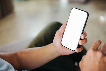 cell phone blank white screen mockup.hand holding texting using mobile on desk at office.background empty space for advertise.work people contact marketing business,technology