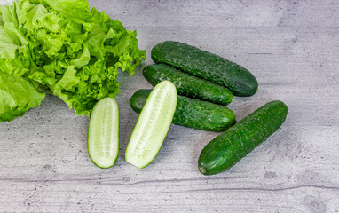 cucumbers and lettuce on the kitchen table