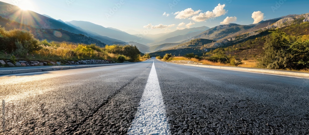 Poster asphalt road in the mountains with soft sky on the background. copy space image. place for adding te
