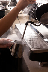 Steaming milk for coffee. Close-up.