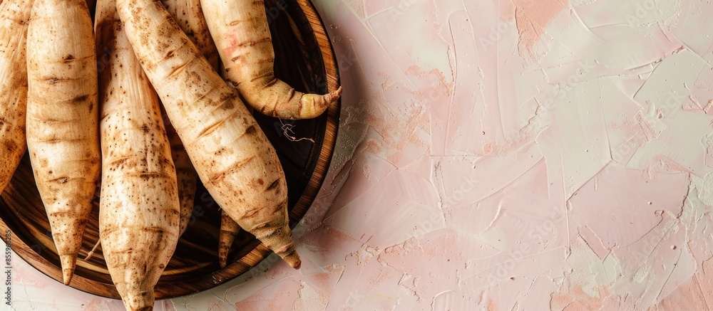 Poster yacon roots plate isolated on a pastel background yams. copy space image. place for adding text and 