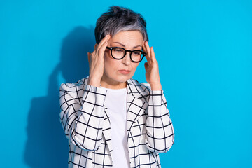 Photo of tired retired woman wear white trendy clothes suffer pain tension isolated on blue color...
