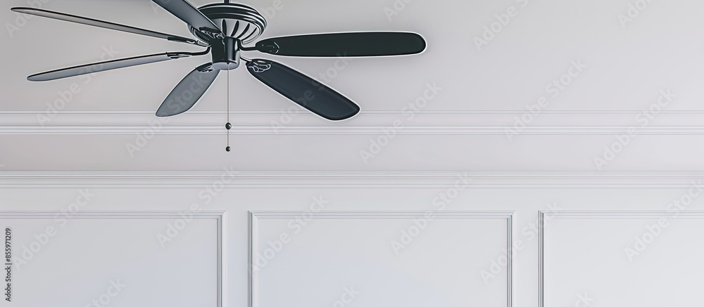 Poster ceiling fan with five blades hangs from white ceiling. copy space image. place for adding text and d