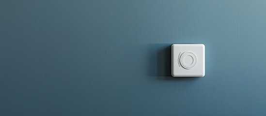 White thermostat socket switch isolated on a grey background . A Honeywell programmable thermostat to control the air conditioner and heater in a home