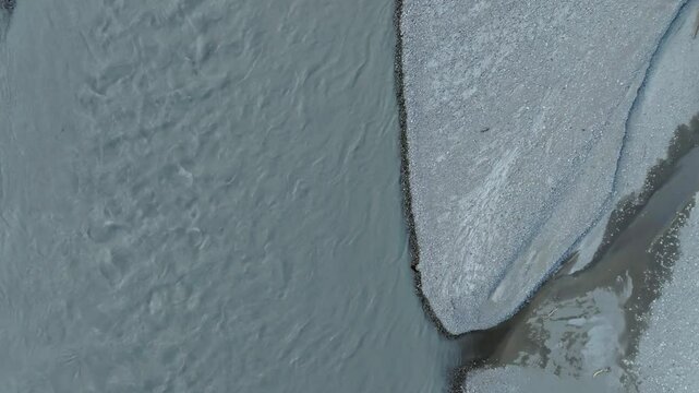 Drone view of the Var River with gravel shore at the daytime in Le Broc, France