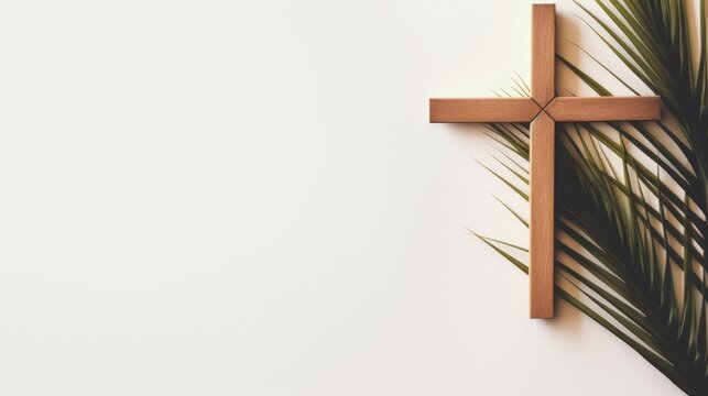 A cross mounted on a wall adorned with palm leaves, symbolizing Palm Sunday on a light background, card, copy space