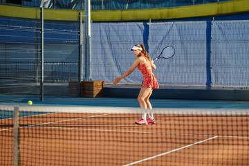 Sports concept, young woman training before playing tennis