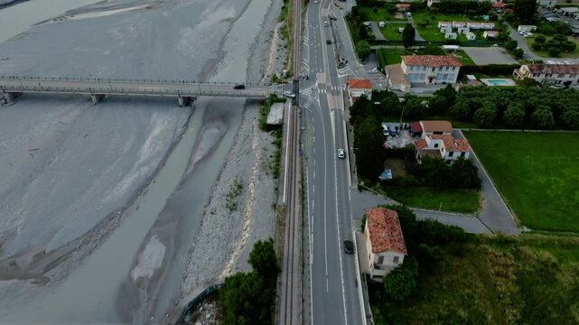 Aerial view of the Pont Charles Albert and the M6202 road on the Var River in Gillette, France
