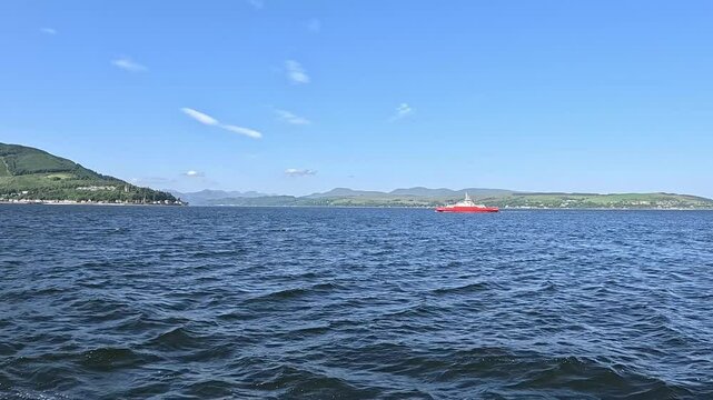 Ferry crossing from Gourock to Dunoon on Firth of Clyde on a sunny day in Scotland, United Kingdom