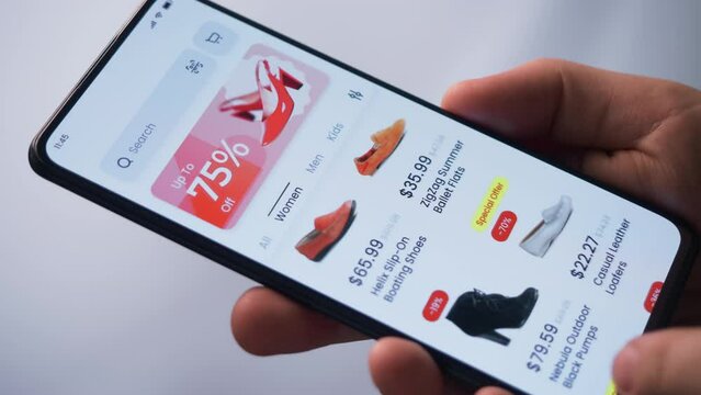 Shopping online for shoes. Sale with great discounts and special offers. Scrolling through a catalog of shoes. Fictional interface.