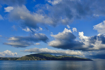 blue sky and clouds and island