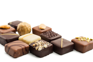 Assorted chocolates on white background