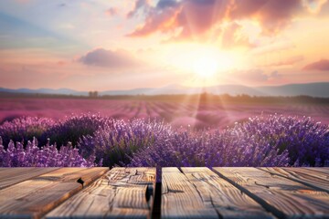 Background of blurry lavender flower fields against a twilight sky with a wooden table