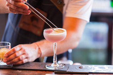bartender makes refreshing alcoholic cocktails and drinks.
fresh summer drinks.