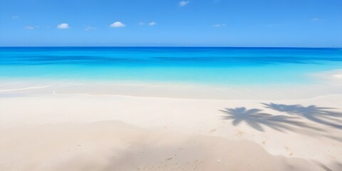 Fototapeta premium A tropical beach background with white sand, clear turquoise water, and a bright blue sky