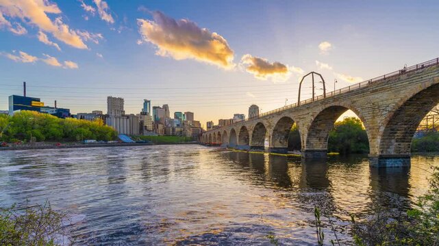 Minneapolis, Minnesota, USA skyline with the Stone Arch Bridge on the Mississippi River