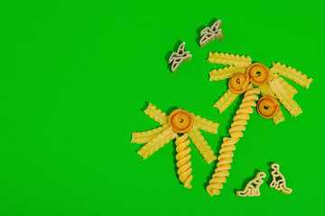 Pasta. Various kinds of uncooked pasta and noodles over wooden background