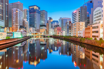 Naklejka premium Osaka, Japan FInancial District Skyline on the Ogawa River