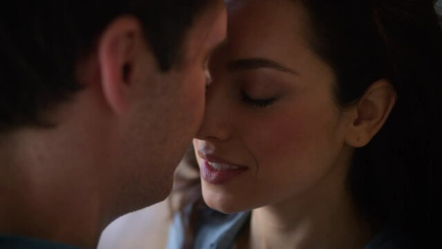 Happy loving couple people family wedding love Caucasian man guy male boyfriend husband wife girlfriend woman girl female cuddling kissing touch faces tender affectionate bonding romantic indoors