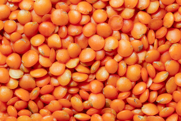 Pile of red lentil . Food background