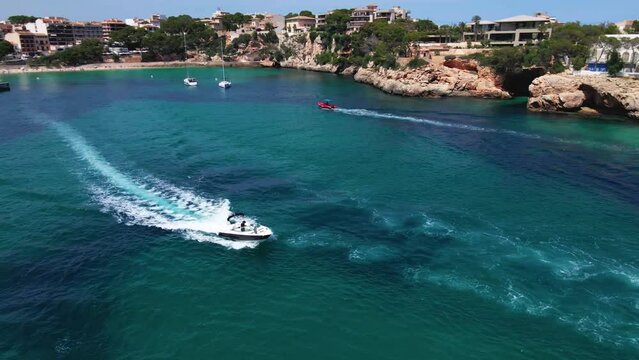 cruising boat in ocean with drone in Mallorca island, Spain with coast