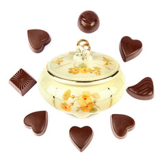 Vintage porcelain candy bow and chocolates isolated on a white.