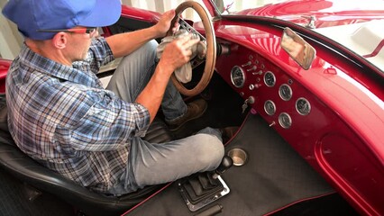 Vintage Vehicles Enthusiast Cleaning a Classic Car Interior