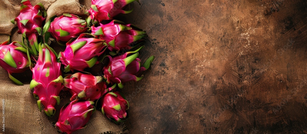 Poster healthy dragon fruits on sackcloth and brown pastel background. with copy space image. place for add