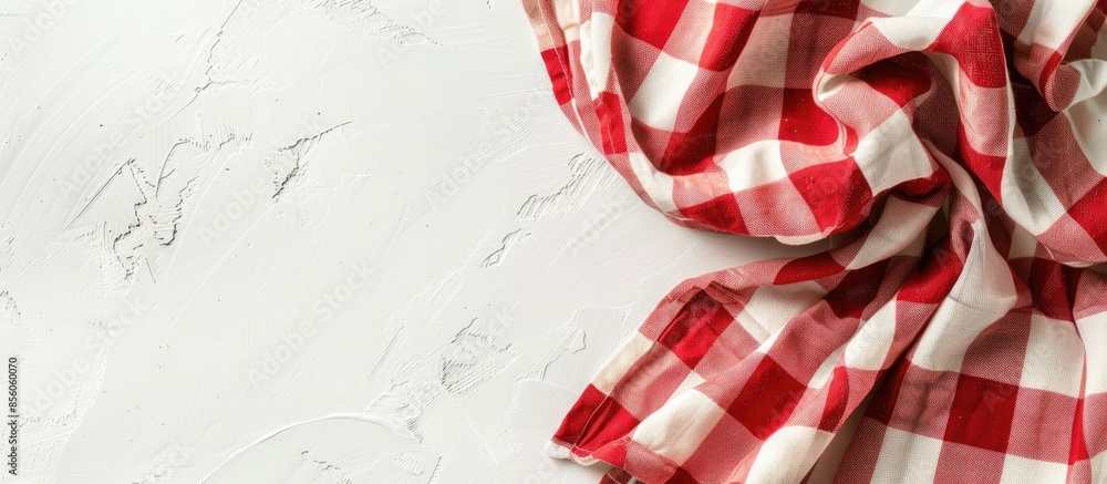Aufkleber the tablecloth checkered red and white fabric cotton folded place on a white table with copy space. 
