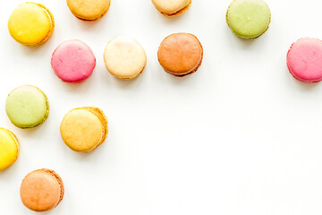 Macarons design on white background top view space for text