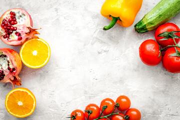 fruits and vegetables for healthy dinner on stone background top view mock up