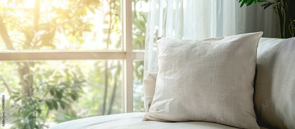 Aufkleber Comfortable pillow on modern sofa next to window with soft light effect. with copy space image. Place for adding text or design