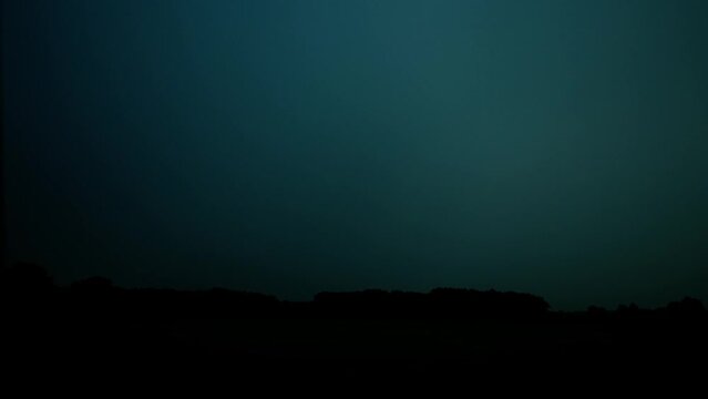 Real Thunder Lightning filmed in the sky by night, flashes in the darkness, thunderbolt storm with lightning bolt, thunderstorm.