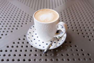 A cup of coffee on the table. Enjoying hot drinks.