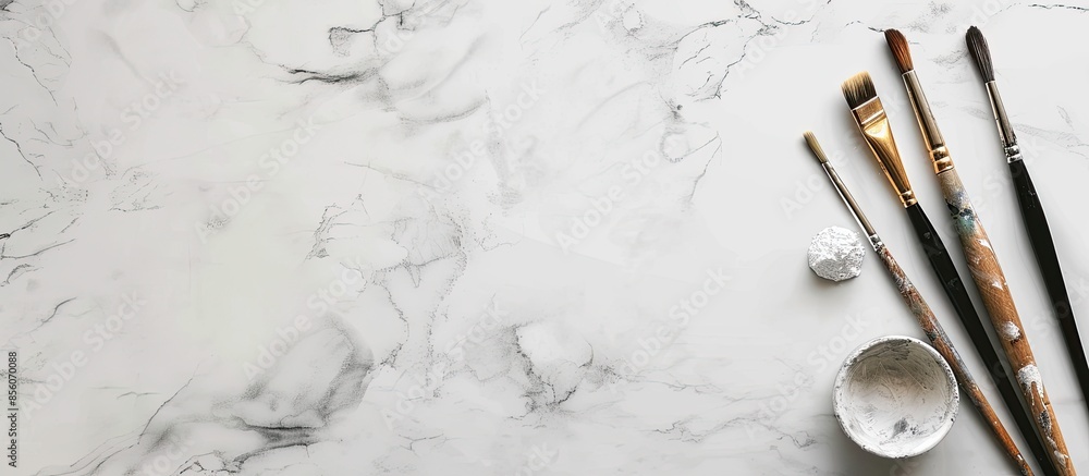 Poster painter's tools.painting tools and white marble background. with copy space image. place for adding 