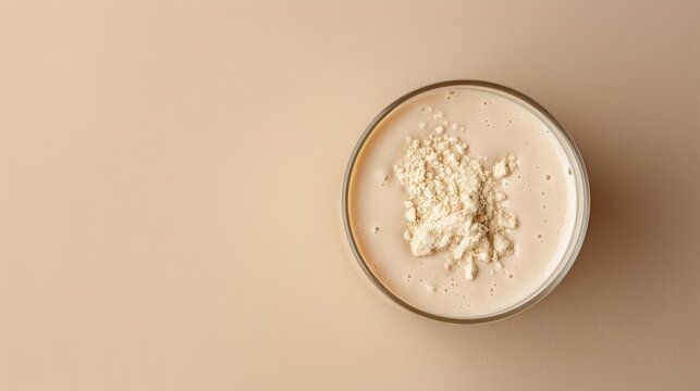 Collagen protein powder mixed in water for skin and bone health on beige background Ample room for text