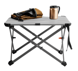 Portable folding camping table with a mug and a bag placed on top, ideal for outdoor activities, against a transparent background.