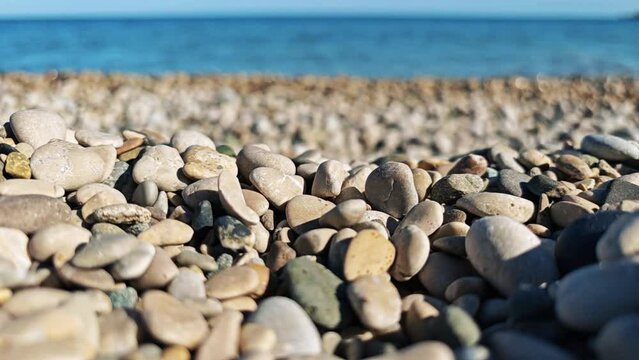 Stones falling on the beach