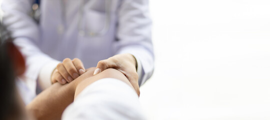 Man with arm pain, wrist pain and shoulder pain is seeing a doctor for diagnosis in an examination room at a hospital.