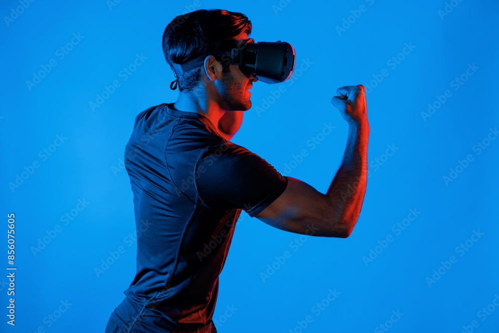 Poster side view of smart man wearing vr glass and smashing or punching at camera. sport gamer boxing and m