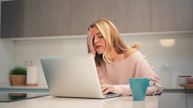 A hard working woman, desperate due to laptop issues causing her stress and headaches. A frustrated and burnout female dealing with excessive work that triggers anxiety and migraines. Job problems