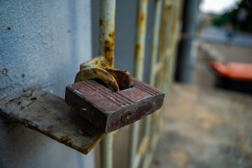 Close-Up of a Rusty Padlock Securing a Metal Gate. limited access internet security Concept no entry secret