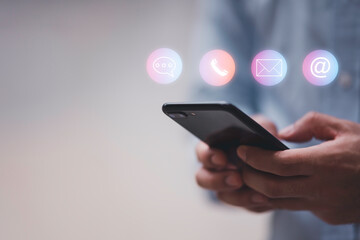 Website page contact us or e-mail marketing concept, Customer support hotline Contact us people connection. Label wood with the email, call phone, address, Chat message icons.