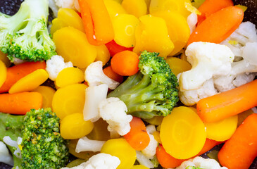 Healthy food, cooking vegetables in a frying pan.