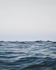 Fototapeta premium This close-up shot of the water captures the subtle movement and texture of small waves, highlighting the beauty of simplicity