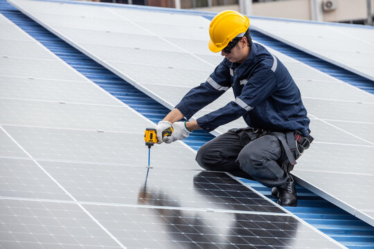 Professional Engineer Service Solar Panel. Worker Maintenance Cleaning Replacing Solar Panel. Solar photovoltaic panel system in Industry roof. Saving Energy with Clean Power.
