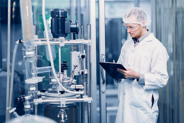 Scientist Medical Factory Staff Working in Science Lab. Medicine factory Technician Employee Check...