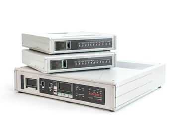 A pair of electronic devices stacked vertically with wires and cords visible