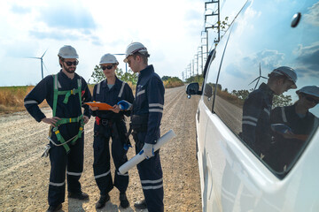 Naklejka premium A team of engineers is inspecting the construction of wind turbines and surrounding structures in remote areas to produce clean electricity and help with sustainability and reduce global pollution.