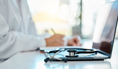 Laptop, stethoscope and hands in doctor office for schedule and online in workplace. Technology,...